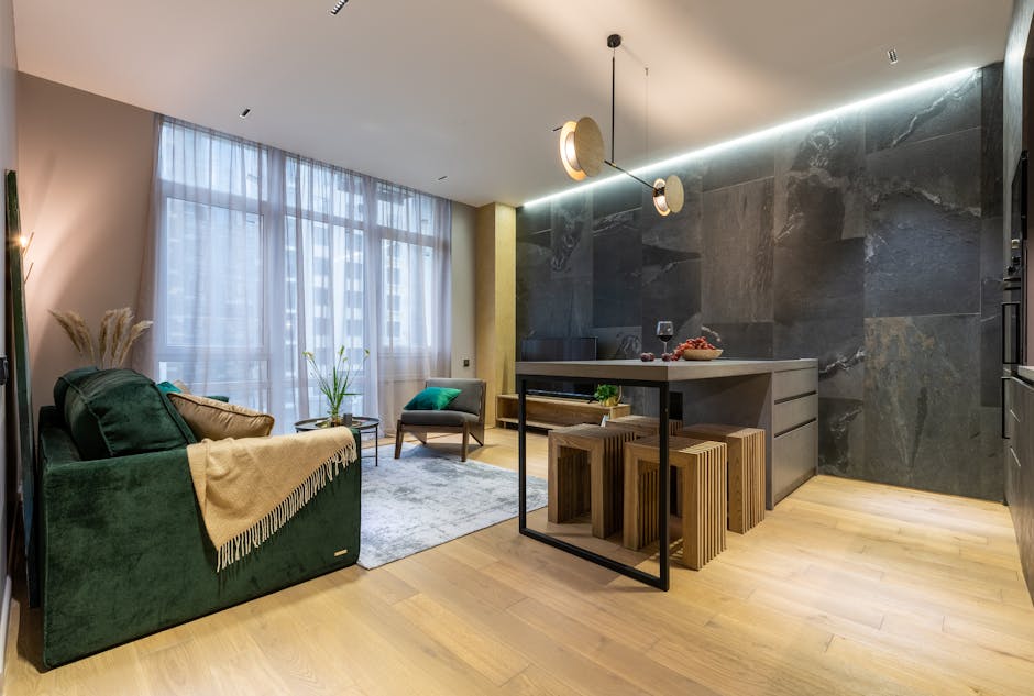 A stylish modern living room with open kitchen and contemporary design elements.