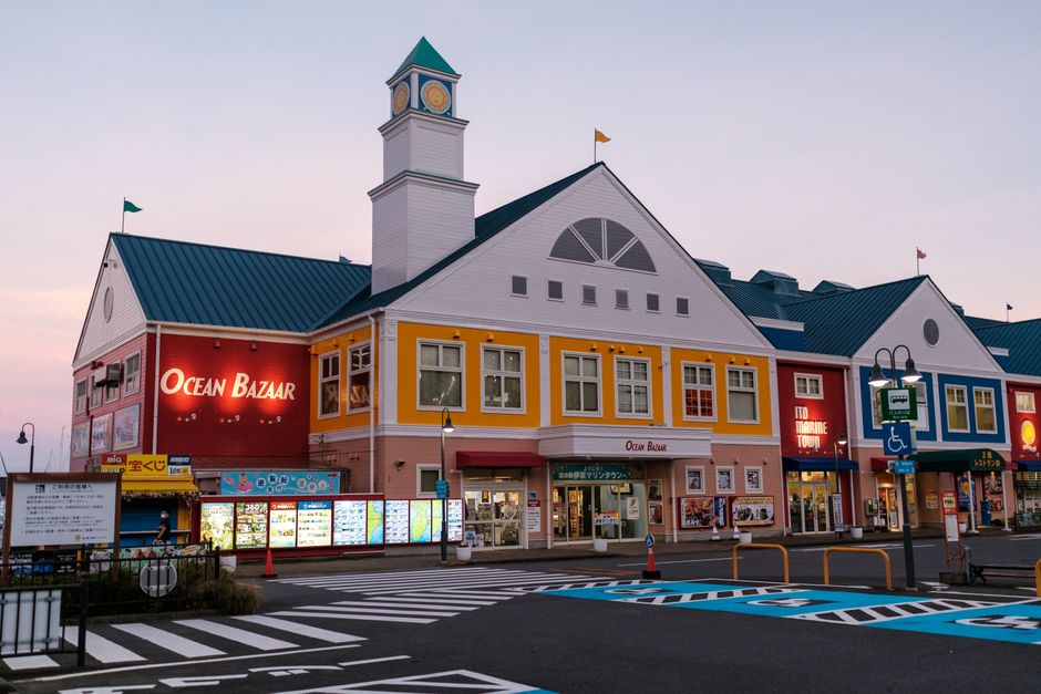 A colorful building at Ocean Bazaar during twilight with vibrant architecture and a calm ambiance.